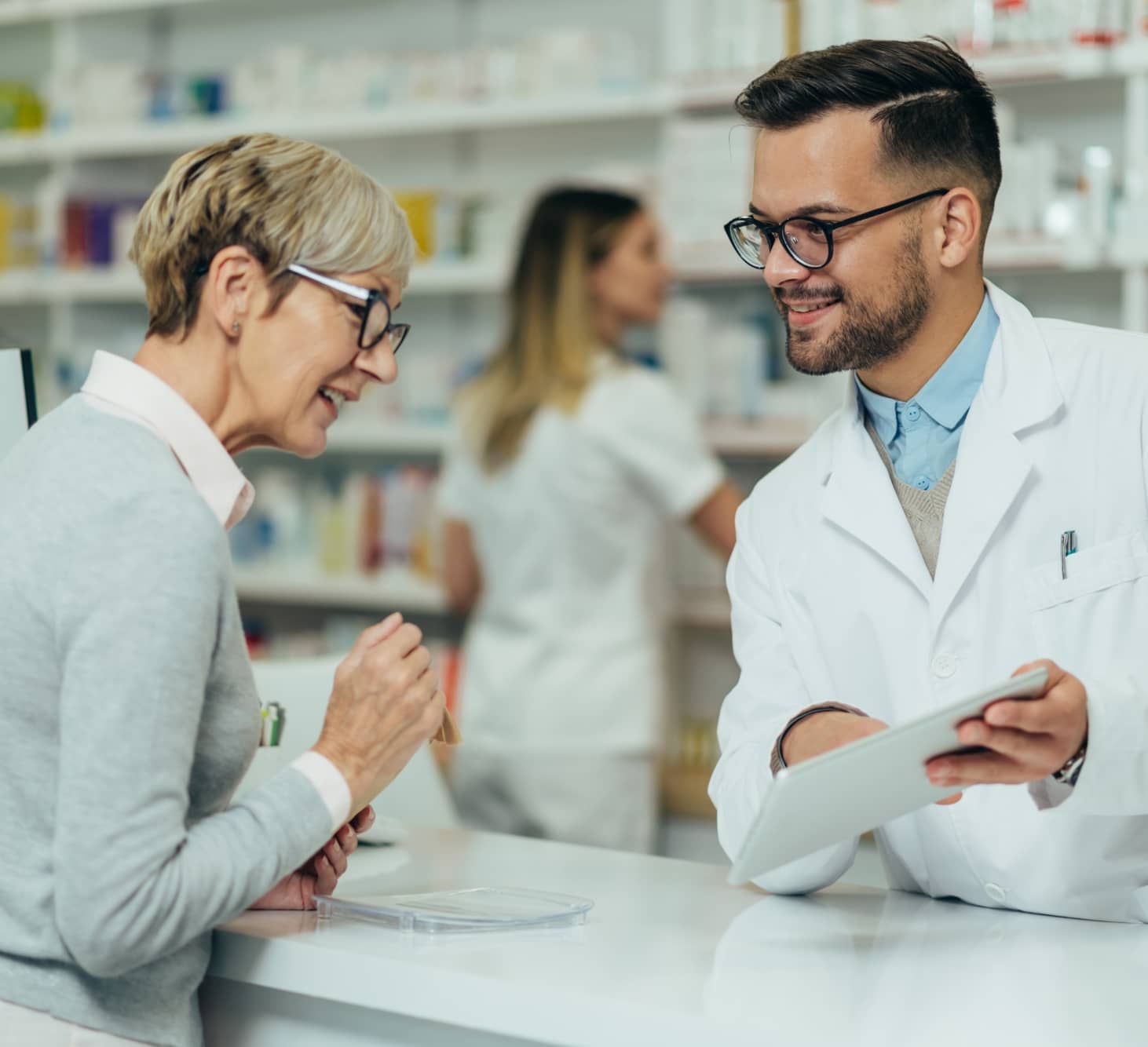 Woman talking to pharmacist