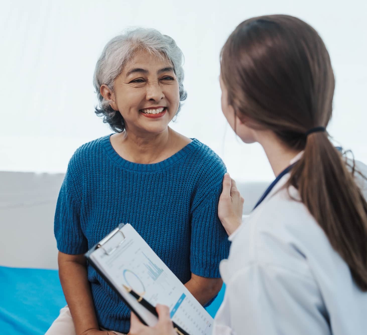 Woman talking to doctor